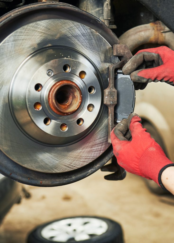 Mechanic checking a vehicles brakes - Brake Repairs in Castle Donington